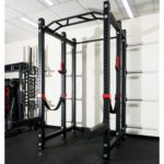 Modular 11-gauge steel power rack by FITEK, angled view highlighting the 4-way hole design.